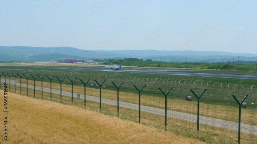 Small passenger plane landing in the airport back lateral view Small passenger plane landing in the airport back lateral view