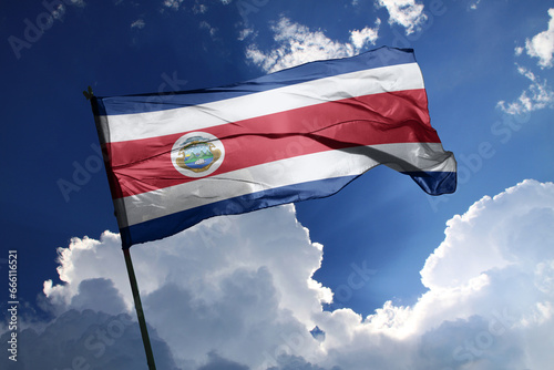 national flag of Costa Rica waving in the wind on a clear day.