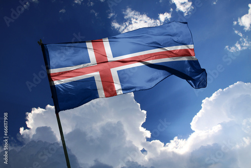 national flag of Iceland waving in the wind on a clear day.