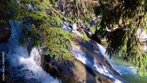 Waterfall of Studeny potok stream in the National Park High Tatra, Slovakia photo