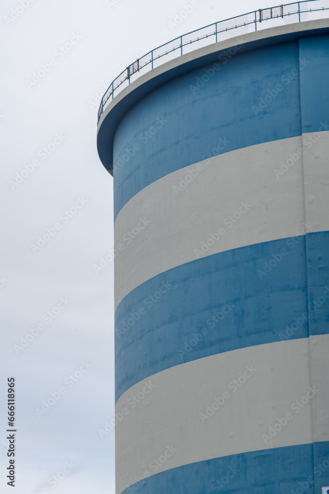 Part of a blue and white large silo