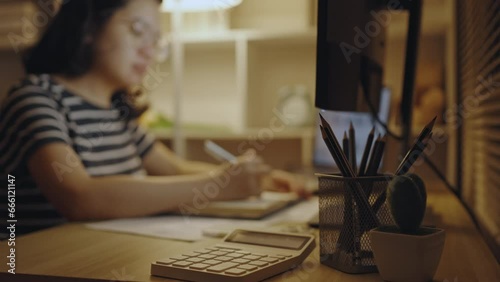 Blur footage of young woman taking teaching notes and doing homework in the middle of the night, Take notes messages during the teacher's teaching, Doing homework in the middle of the night