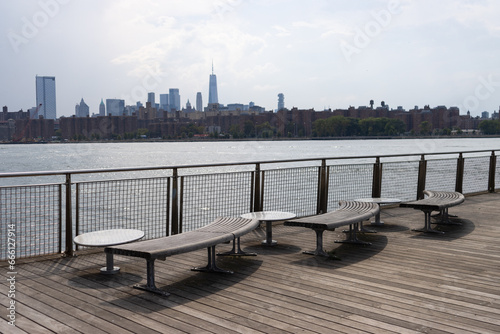 Canvas Print Empty Benches on the North 5th Street Pier and Park along the East River with a