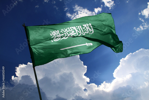 national flag of Saudi Arabia waving in the wind on a clear day.