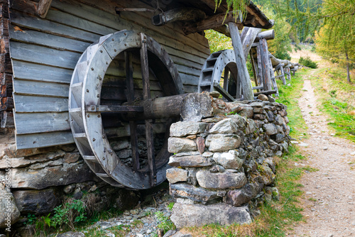 Detailed capture of the paddle wheel of a wooden water mill photo