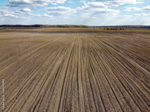 Treated farm field, aerial view. Agricultural land.