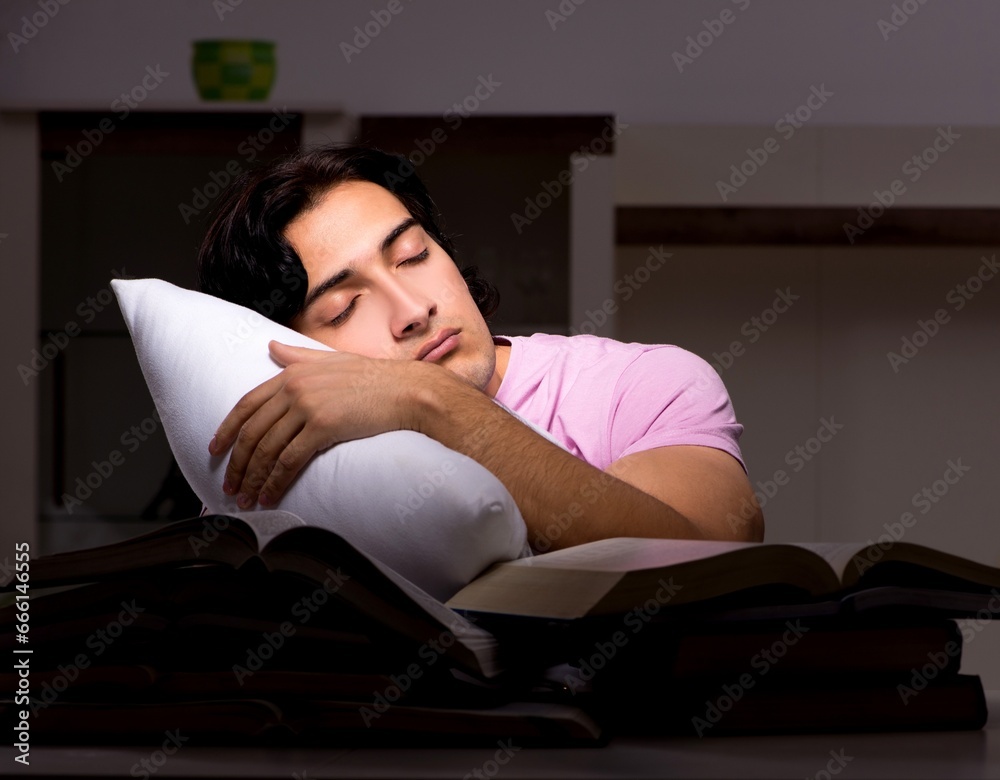 Male handsome student preparing for exams late at home Male handsome student preparing for exams late at home