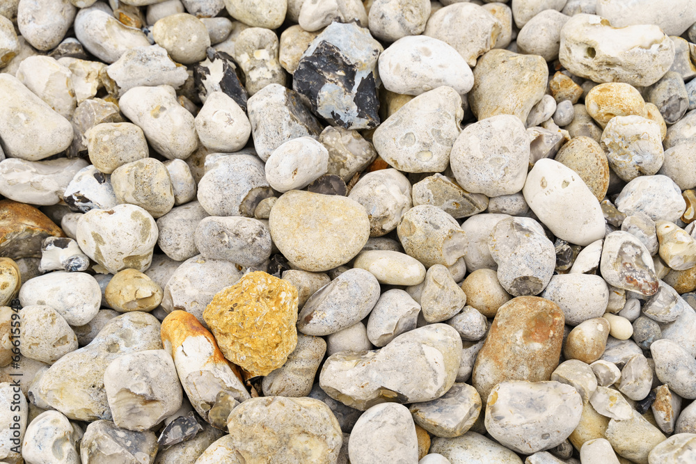 Texture of gray stones lying along the sea coast. Texture of gray stones lying along the sea coast.
