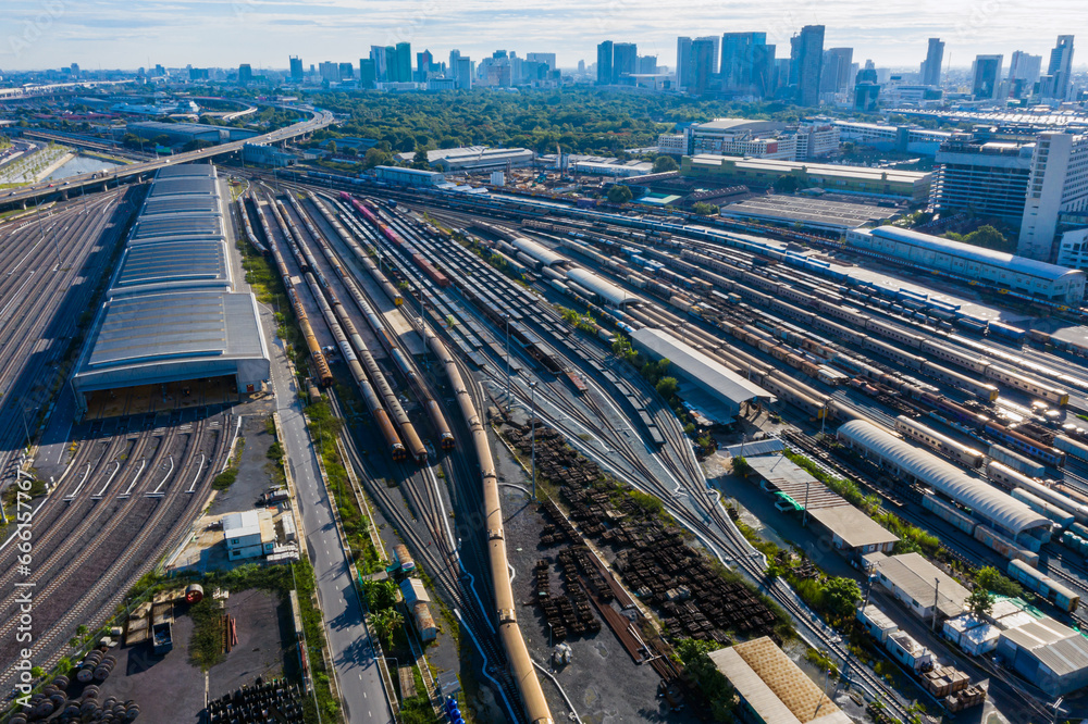 Aerial top view of train container cargo on the railway station for