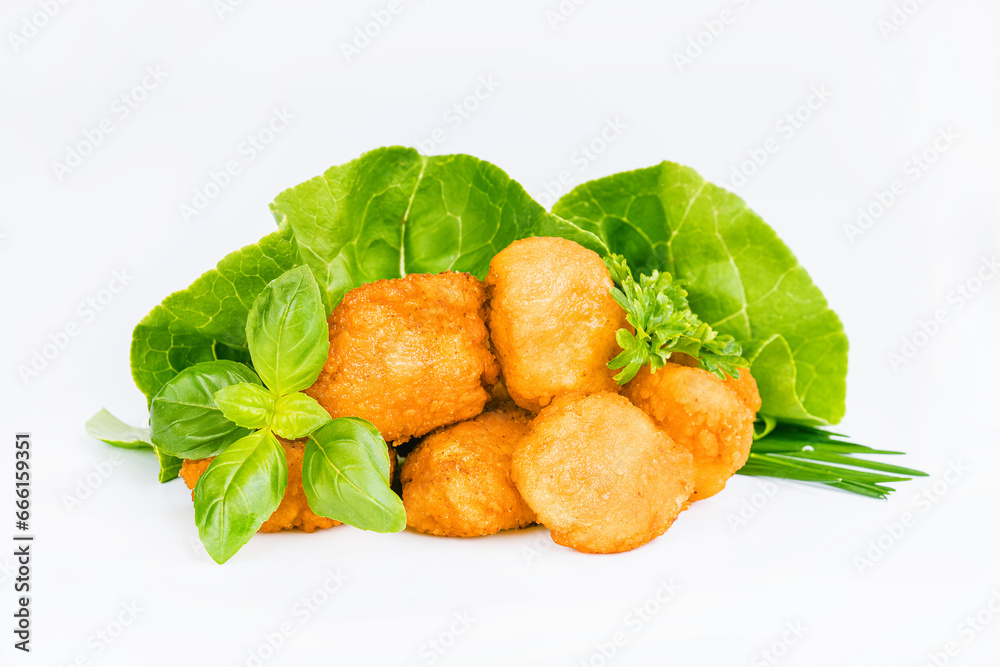 Breaded chicken nuggets.Breaded Chicken Inner Fillet with green lettuce leaves on a White Background.Chicken Breaded Raw Meat,Fillet.Fast homemade food at home. Chicken breaded schnitzels.Fast cooking Breaded chicken nuggets.Breaded Chicken Inner Fillet with green lettuce leaves on a White Background.Chicken Breaded Raw Meat,Fillet.Fast homemade food at home. Chicken breaded schnitzels.Fast cooking