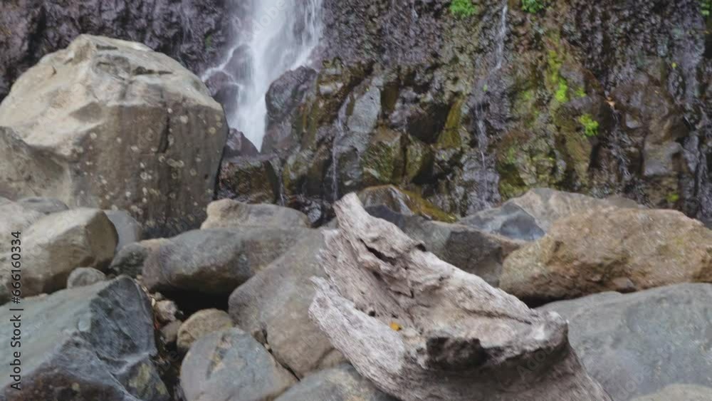 Water fall on the tropical forest, water stream and splash water when rainy season. The footage is suitable to use for adventure content media, nature and forest footage background. Water fall on the tropical forest, water stream and splash water when rainy season. The footage is suitable to use for adventure content media, nature and forest footage background.