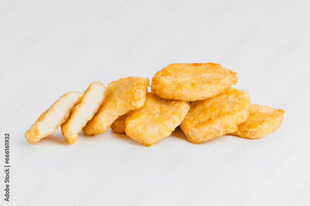 Breaded Chicken Inner Fillet on a White Background,Chicken Breaded Raw Meat.Chicken Breaded Fillet.Fast food. Fast cooking. Breaded chicken nuggets. Homemade food at home. Breaded Chicken Inner Fillet on a White Background,Chicken Breaded Raw Meat.Chicken Breaded Fillet.Fast food. Fast cooking. Breaded chicken nuggets. Homemade food at home.