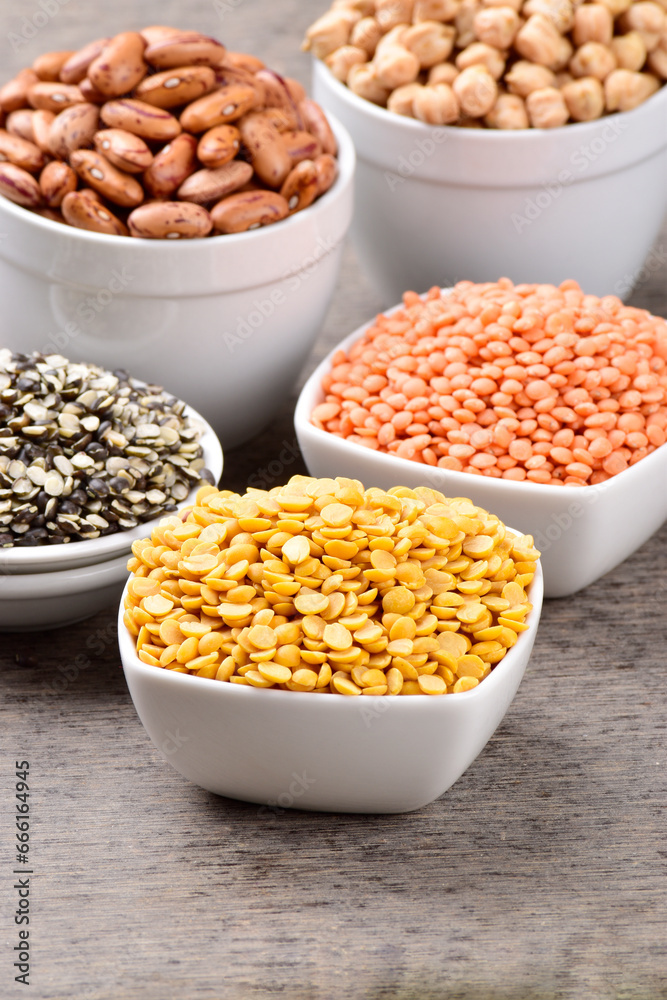 Raw chana dal with red lentils in bowl at table Raw chana dal with red lentils in bowl at table