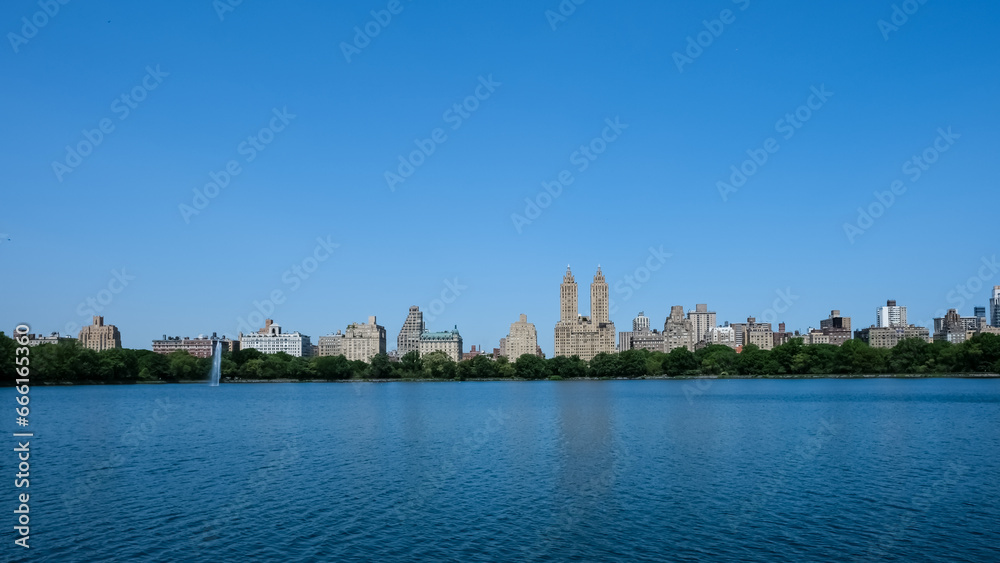 Cityscape of New York City from the Jacqueline Kennedy Onassis Reservoir, also known as Central Park Reservoir, a decommissioned reservoir in Central Park in the borough of Manhattan. 