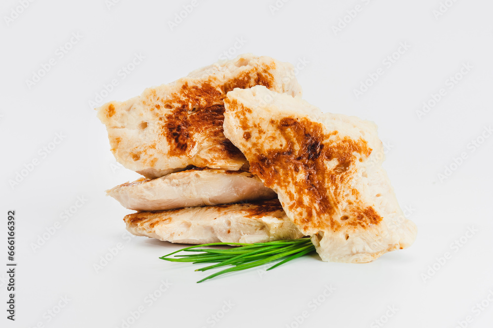 Fast cooking.Chicken fillets fried until half cooked, semi-finished product on a white background. Fast homemade food.Fast food. Quick cooking at home. Copy space. Fast cooking.Chicken fillets fried until half cooked, semi-finished product on a white background. Fast homemade food.Fast food. Quick cooking at home. Copy space.