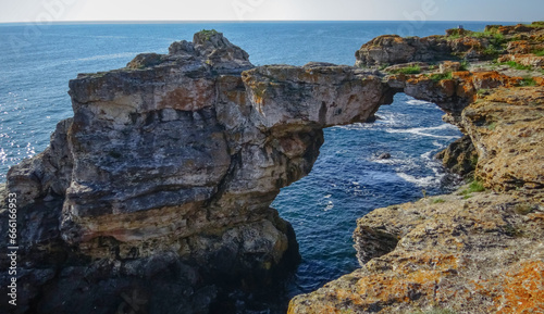 Large arch in coastal rocks made of shell rock near the village of Tyulenovo