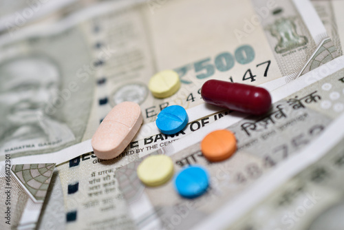 Medicine pills and tablet with indian currency note