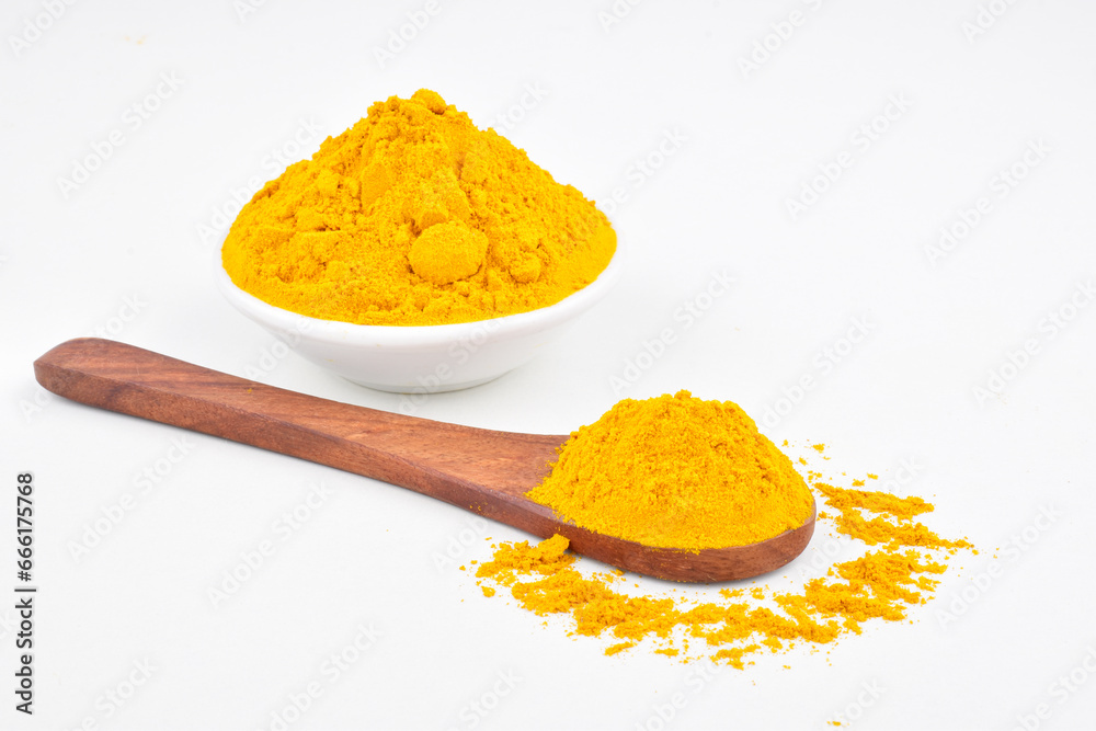 Haladi powder in spoon and bowl on white background, healthy indian spice Haladi powder in spoon and bowl on white background, healthy indian spice