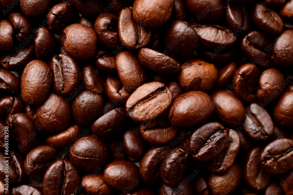 Fototapeta premium Top view of roasted coffee beans texture background