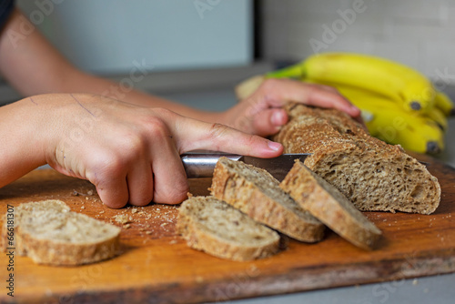 cut banana bread on a cutting board in the kitchen.