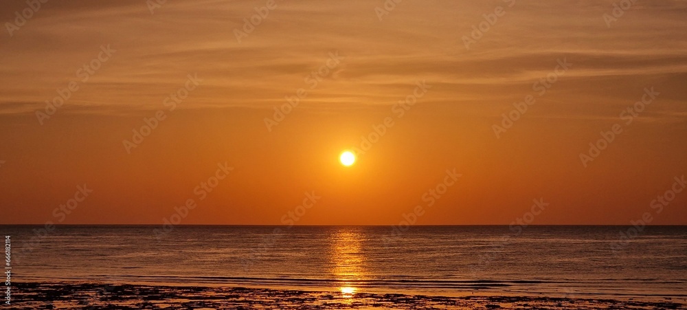 sunrise in early morning hours in egypt close to Marsa alam sun reflexion in the red sea
