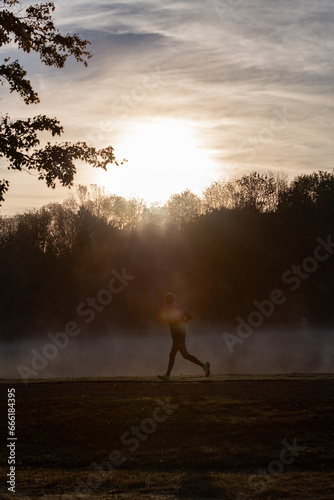 Early morning run in haze and fog with copy space