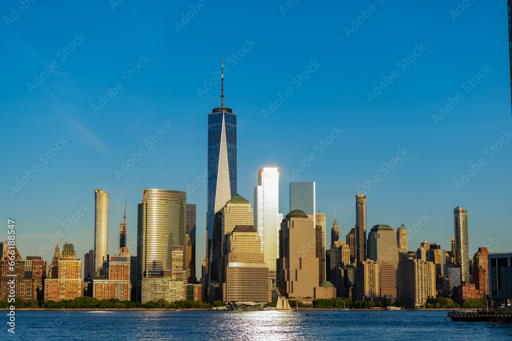 Fototapeta premium new york downtown. manhattan skyline in sunset. new york city. skyscraper building of nyc. ny urban city architecture. midtown manhattan and hudson river. metropolitan city cityscape. majestic view