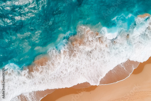 Sea wave and beach aerial. Foam from a sea wave on the beach. Rocks and sand