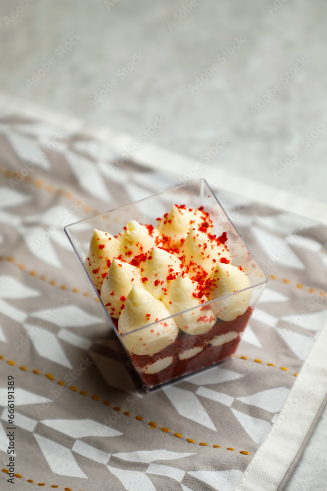 Red Velvet Mousse Jar isolated on napkin side view of cafe baked food on background Red Velvet Mousse Jar isolated on napkin side view of cafe baked food on background