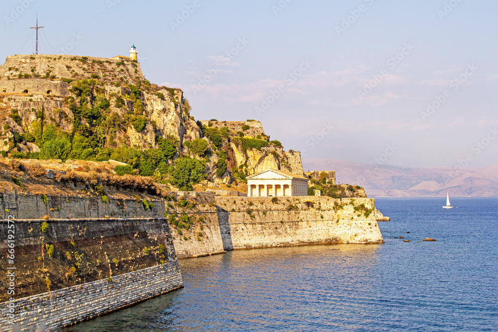 corfu fort overlooking saint george temple on a warm afternoon, landscape view.