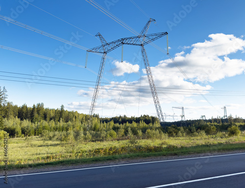 Electricity tower, mast. Electric energy transmission in field near road