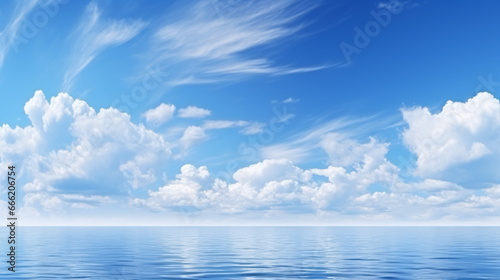 A seascape background featuring a cerulean sky with cumulus clouds is wallpaper-ready. © ckybe