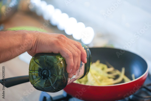 Man cooking in kitchen  hands close-up