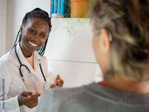 young female doctor ready to use a stethoscope with her patient