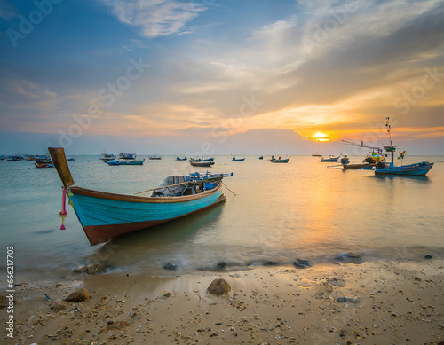 Beautiful sunset landscape sunset on the sea beach with a boat at Bangpra beach chonburi,thailand