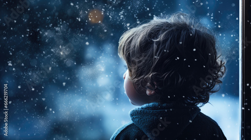 Portrait of A child s silhouette in front of a frosty window  gazing at falling snowflakes.