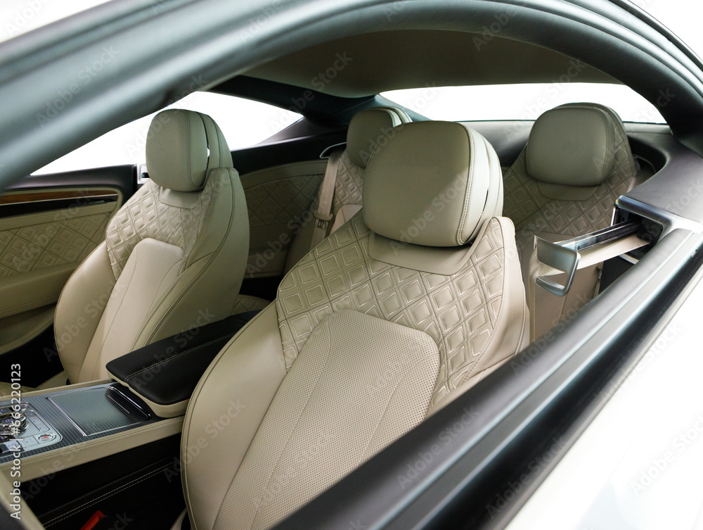 interior of a luxury coupe with light leather interior on a white background interior of a luxury coupe with light leather interior on a white background