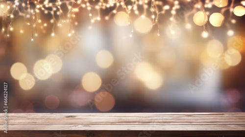 Wooden table against bokeh of christmas lights at night