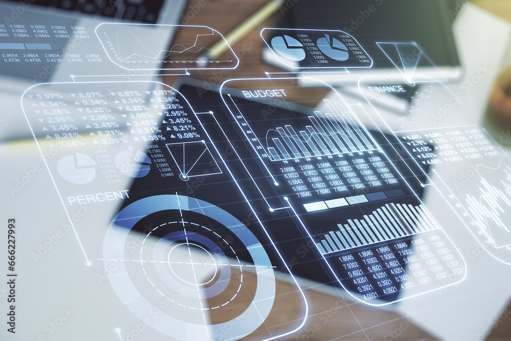 Multi exposure of creative statistics data hologram and digital tablet on background, top view, stats and analytics concept Multi exposure of creative statistics data hologram and digital tablet on background, top view, stats and analytics concept