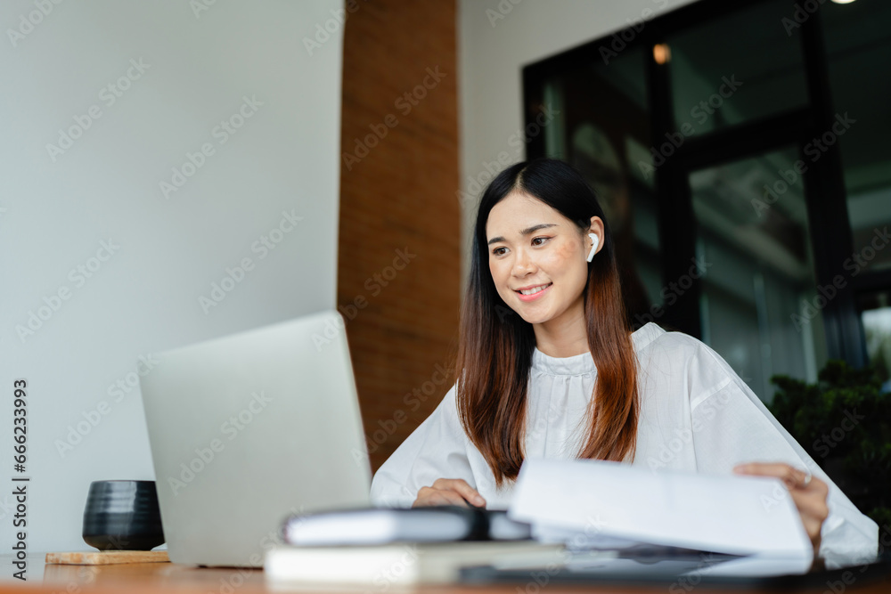 Writer woman reading to checking document and typing business information content on laptop in cafe.. Writer woman reading to checking document and typing business information content on laptop in cafe..