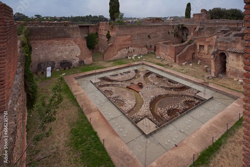 Inner courtyard of Domus Augustana, private part of the Palace of Domitian (Palazzo di Domiziano) of the Palatine Hill, within the archaeological park of the Colosseum, Rome, Italy photo