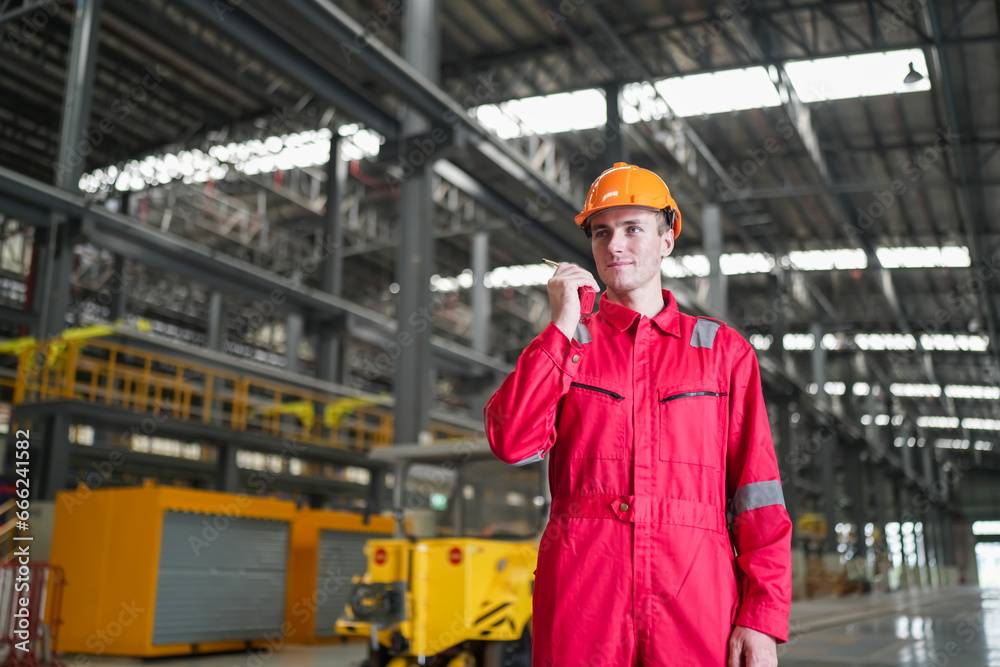 Portrait of engineer and apprentice in workshop of railway engineering facility