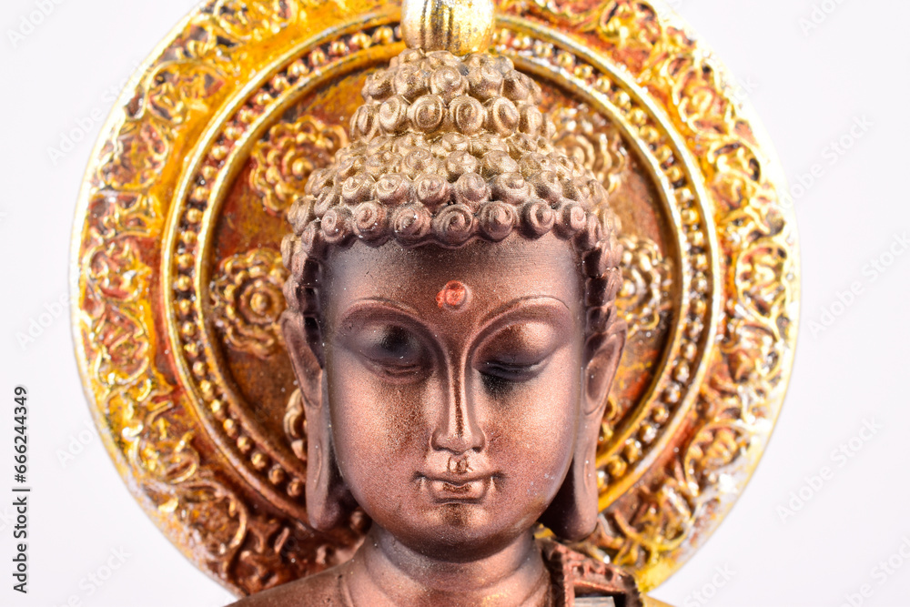 Closeup of buddha face isolated on white background