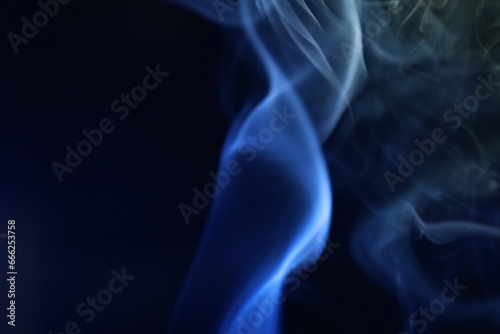Yellow and blue smoke on a dark background, colourful abstract, one line, minimalistic art