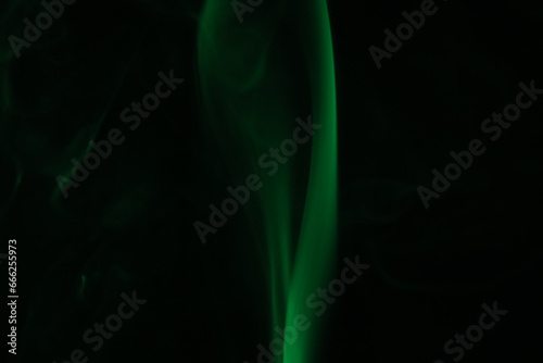 Green lines, green smoke on a dark background, colourful abstract, green fog, minimalism, line of light