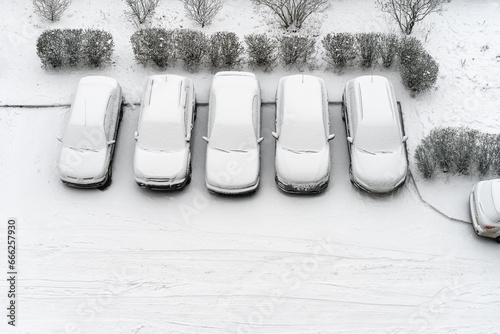 Принти на полотні Winter parking lot cars under snow covered cars winter season