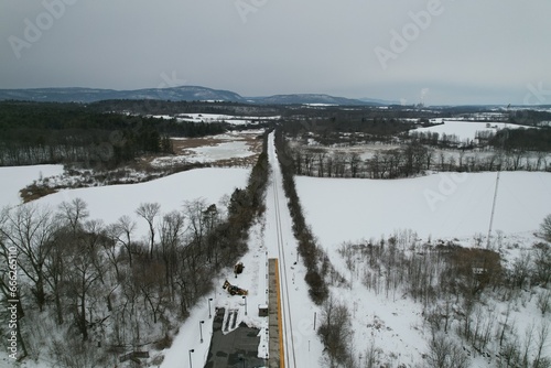 Remote train tracks and station in the winter 