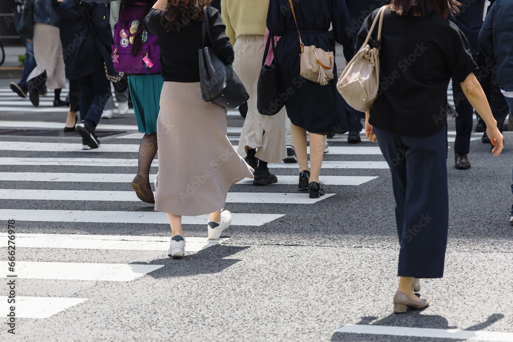 crowds of people crossing a city street in Tokyo, Japan crowds of people crossing a city street in Tokyo, Japan