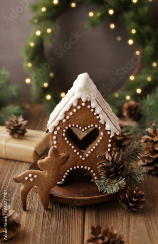 christmas gingerbread cookies, gift boxes and festive table setting for Christmas