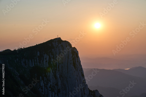 Cross in the mountains and incredible sunset. Upper Austria.